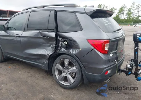 2021 Honda Passport 2Wd Touring from USA, damaged, VIN 5FNYF7H98MB012921